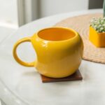 Home 10Club Ceramic Mug – 320 ML Yellow Curved Cup for Home & Office, Ideal for Soup, Coffee, and Tea – Microwave & Dishwasher Safe, Perfect Gifting Option, 1pc